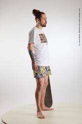 Nigel Standing Pose With Skateboard